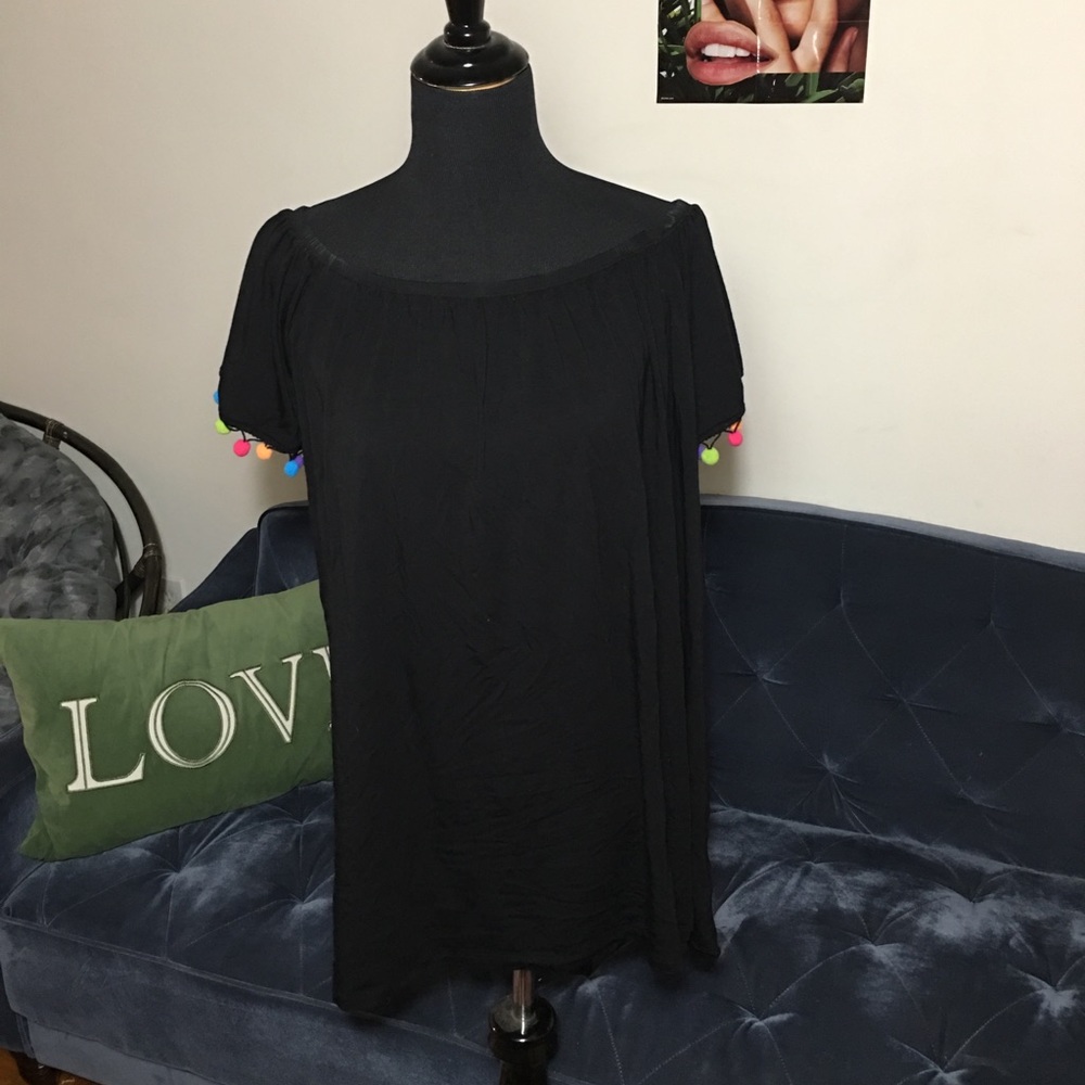 Off shoulder black dress w/ colored pom-poms